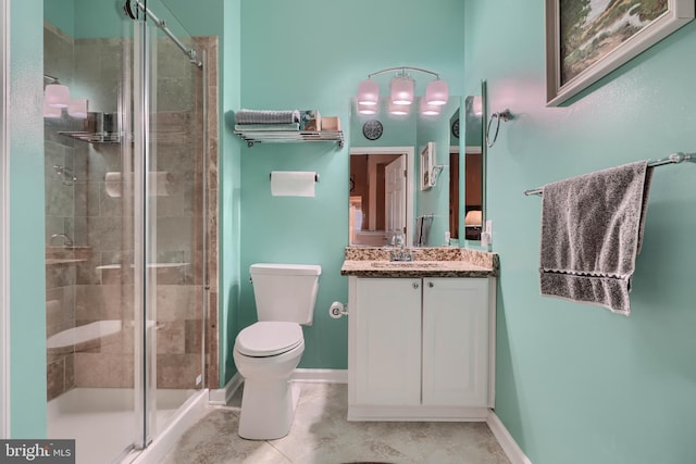 bathroom featuring vanity, toilet, and walk in shower