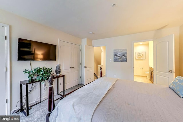 bedroom featuring ensuite bathroom and a closet