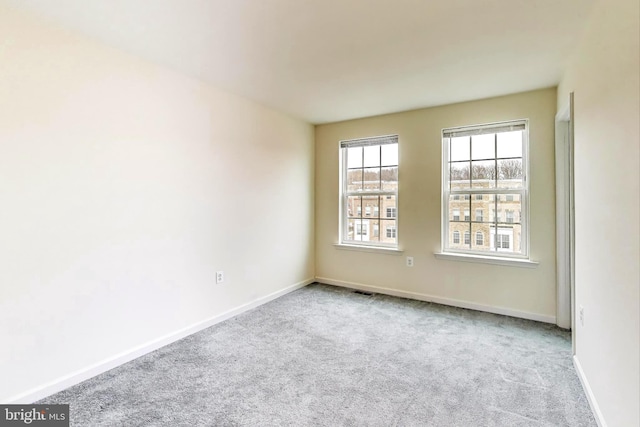 empty room featuring light carpet