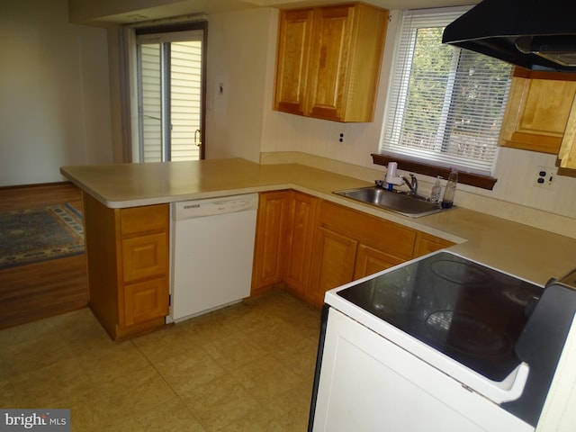 kitchen with sink, exhaust hood, white dishwasher, kitchen peninsula, and electric stove