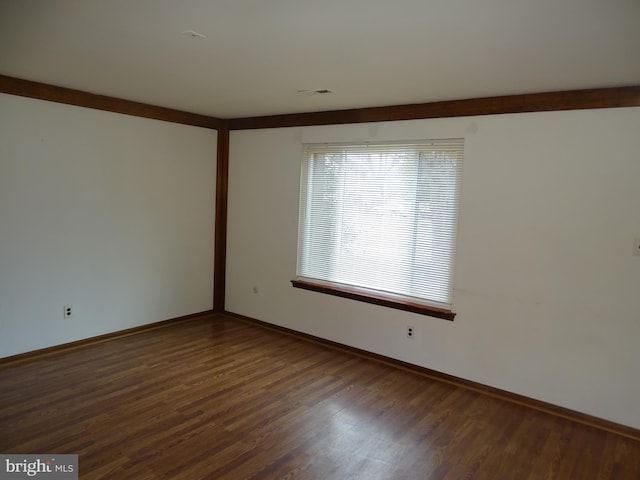 unfurnished room featuring dark hardwood / wood-style floors