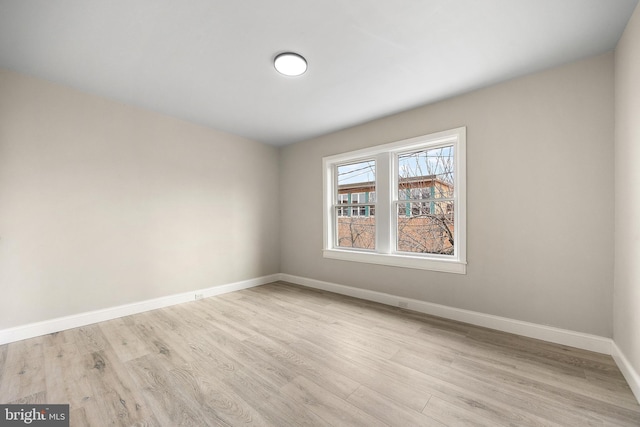 spare room featuring light hardwood / wood-style floors