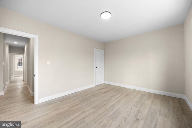 unfurnished room featuring light wood-type flooring