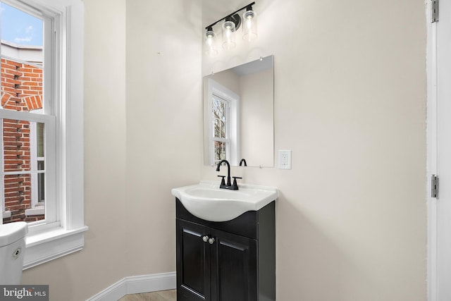 bathroom with vanity and toilet