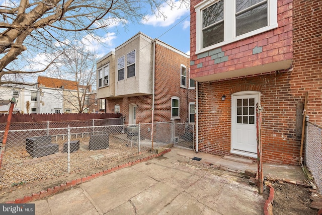 rear view of property featuring a patio