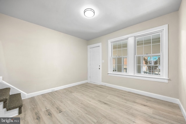 spare room with light wood-type flooring