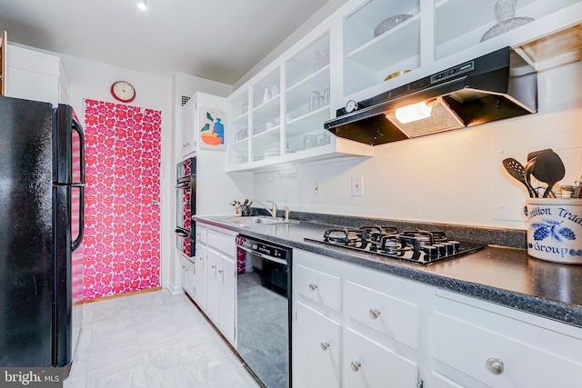 kitchen featuring white cabinetry, sink, and black appliances