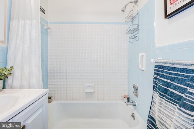 bathroom featuring vanity and shower / bath combo with shower curtain