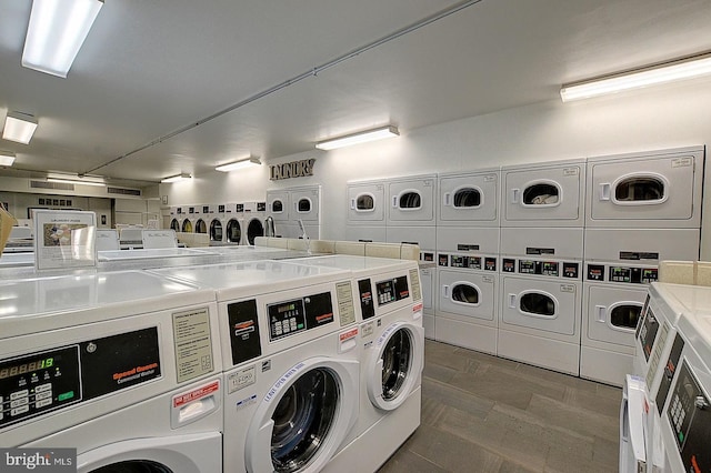 laundry area with washer and clothes dryer and stacked washer and clothes dryer