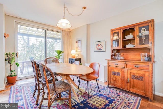 dining space featuring hardwood / wood-style floors