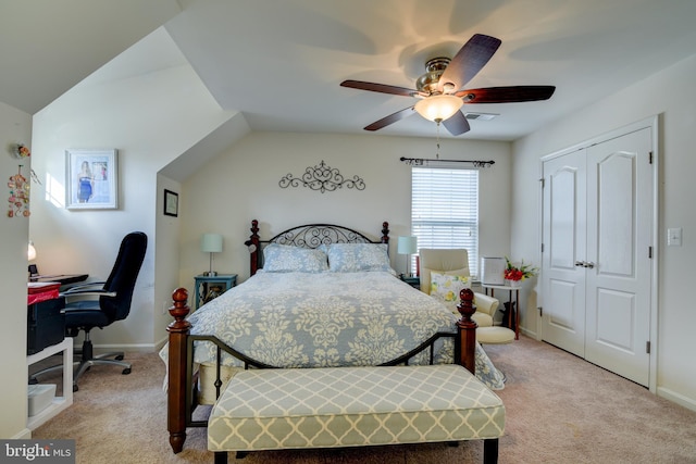 bedroom featuring light carpet, ceiling fan, and a closet