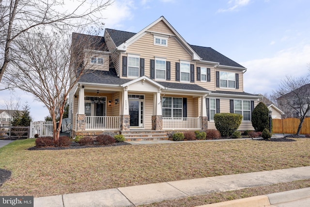 view of front of home featuring a porch and a front lawn