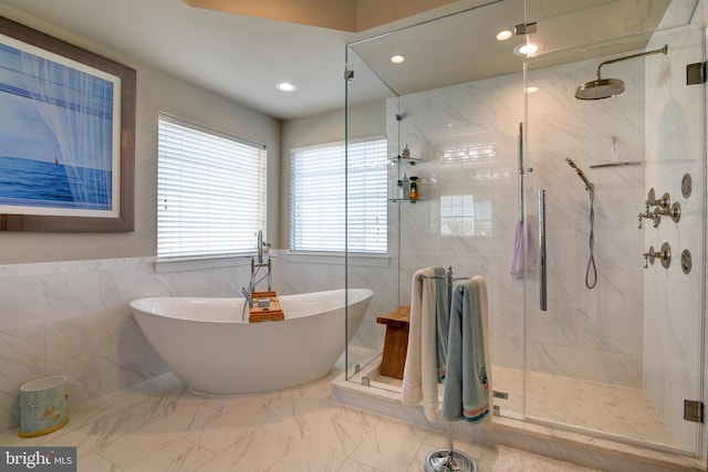 bathroom with shower with separate bathtub