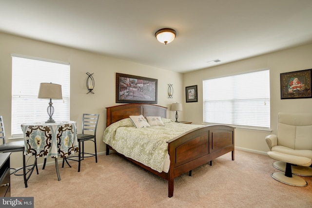 bedroom featuring light colored carpet