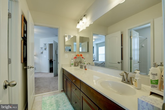 bathroom with vanity, tile patterned floors, and walk in shower