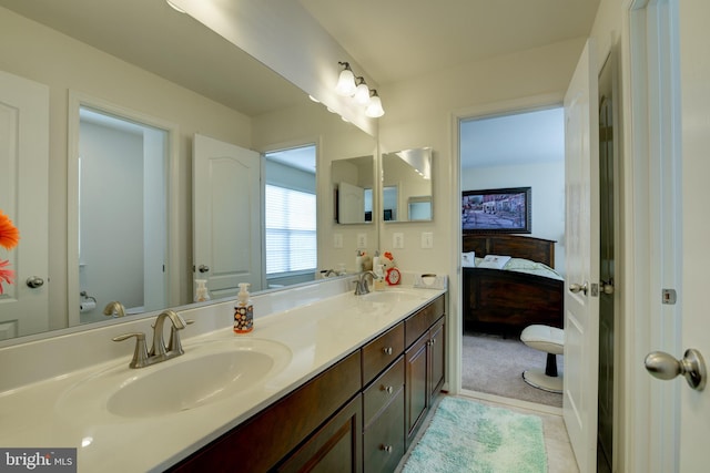 bathroom featuring tile patterned flooring and vanity