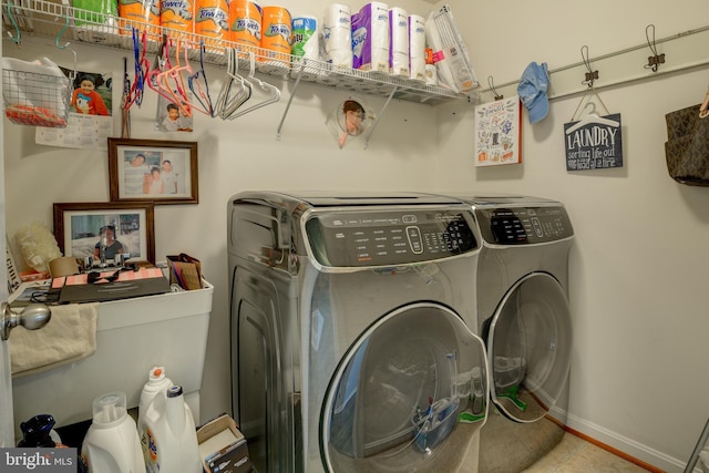 laundry room featuring washer and clothes dryer