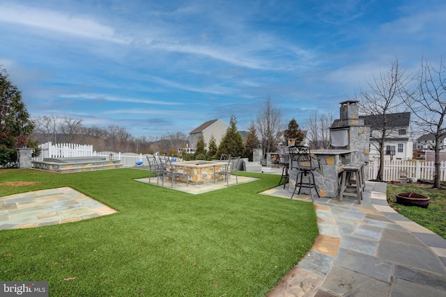 view of yard with an outdoor bar and a patio area