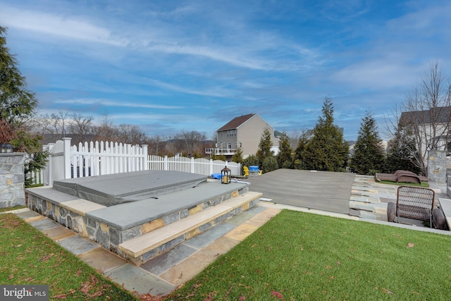 deck featuring a lawn