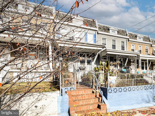 rear view of property with a porch