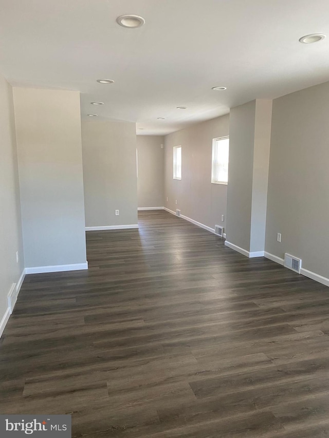 spare room featuring dark hardwood / wood-style flooring