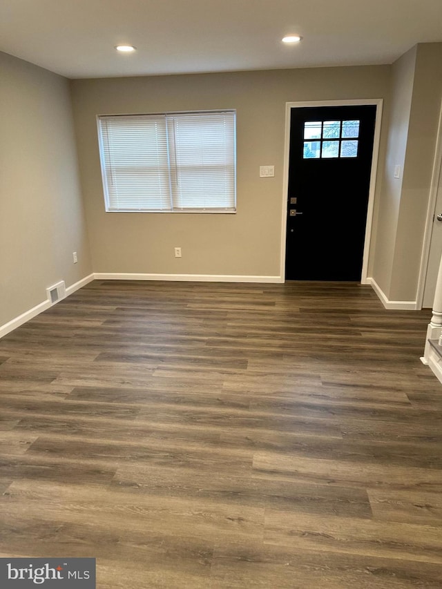 entryway with dark wood-type flooring