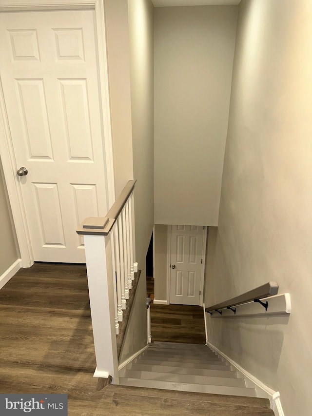 staircase featuring hardwood / wood-style flooring