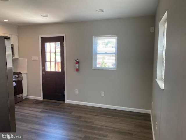 foyer with dark hardwood / wood-style floors