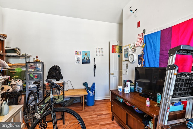 home office with hardwood / wood-style floors