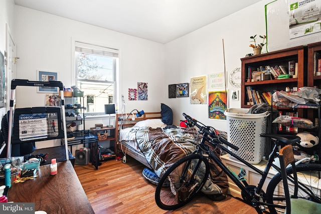 bedroom with wood-type flooring