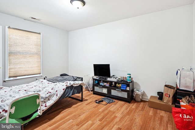 bedroom with wood-type flooring