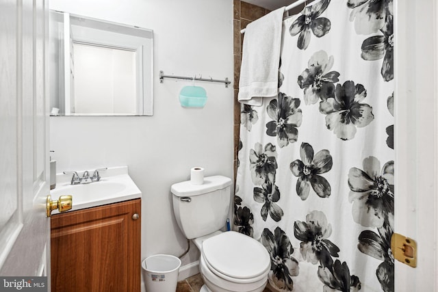 bathroom with vanity, a shower with curtain, and toilet