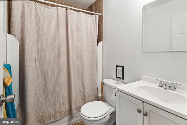 full bathroom with toilet, vanity, and shower / bathtub combination with curtain