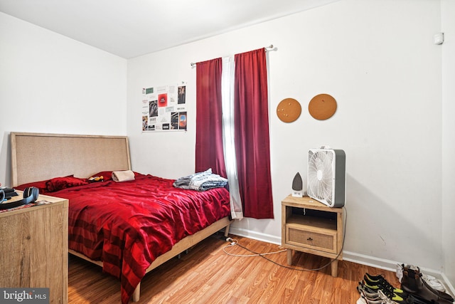 bedroom with hardwood / wood-style flooring