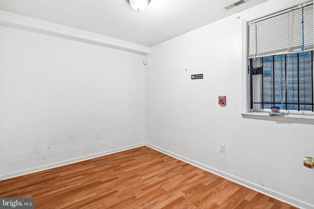 spare room featuring hardwood / wood-style flooring