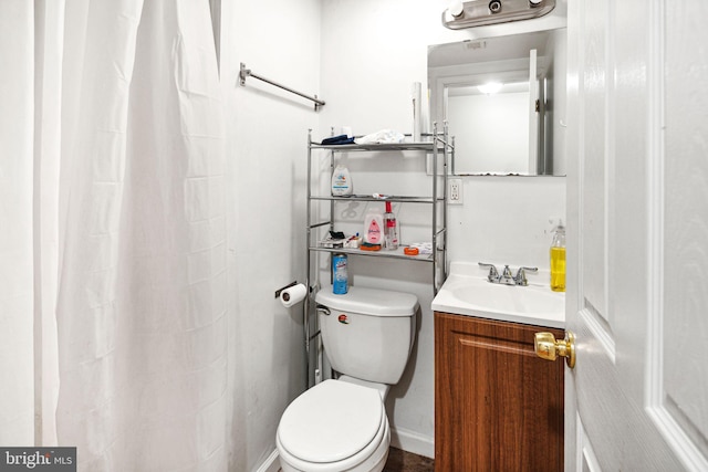 bathroom featuring vanity and toilet