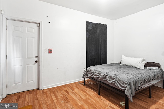 bedroom with hardwood / wood-style flooring