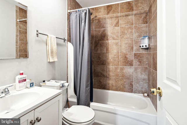 full bathroom with vanity, shower / tub combo, and toilet