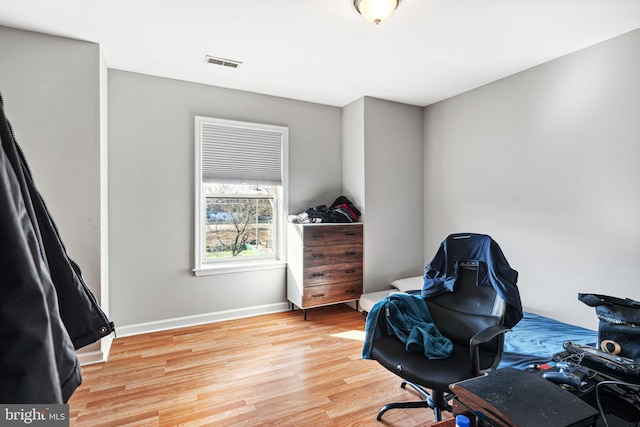 office with light wood-type flooring