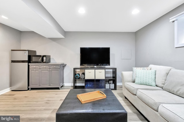 living room with light hardwood / wood-style floors