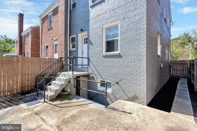 view of side of home with a patio area