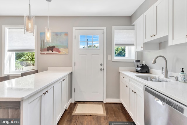 kitchen with dishwasher, sink, hanging light fixtures, and white cabinets