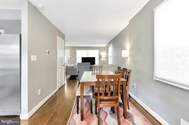 dining space featuring hardwood / wood-style flooring