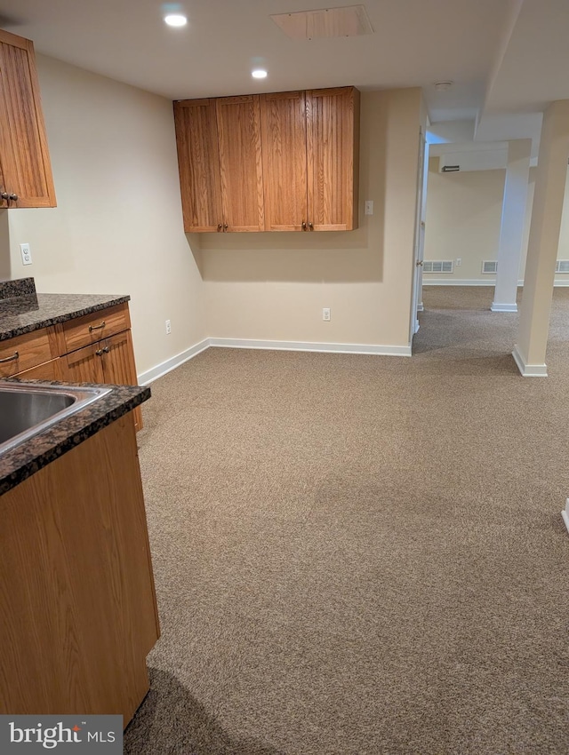 kitchen featuring light colored carpet