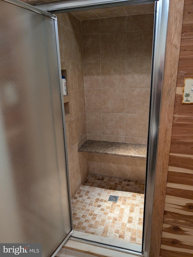 bathroom featuring an enclosed shower