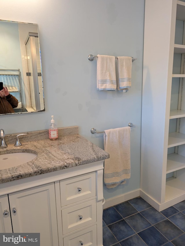 bathroom with vanity and tile patterned flooring