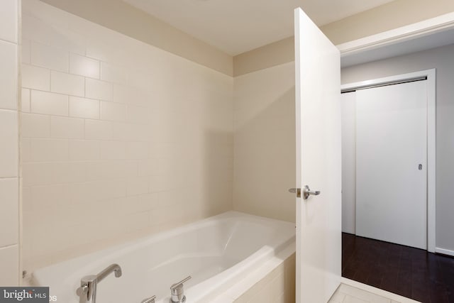 bathroom with a bathing tub and a shower