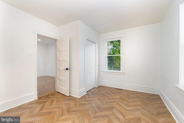 empty room featuring light parquet flooring