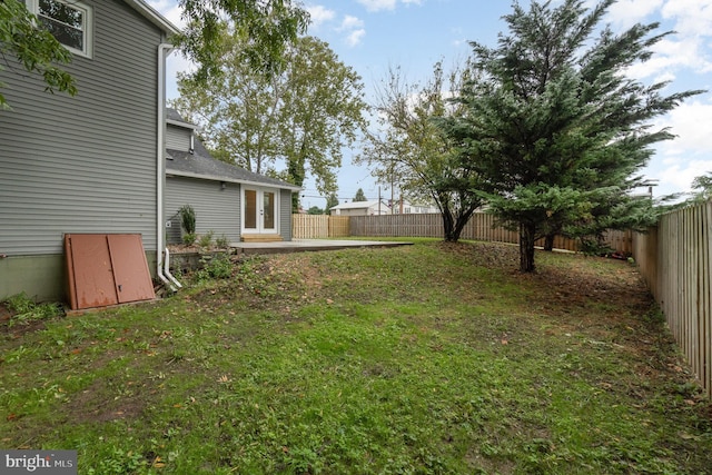 view of yard with french doors