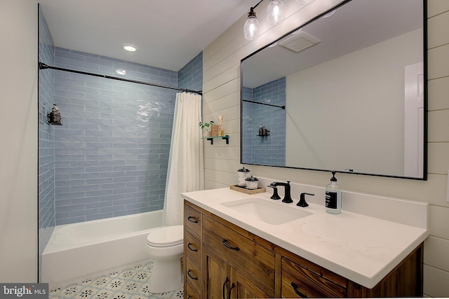 full bathroom featuring shower / bathtub combination with curtain, toilet, and vanity